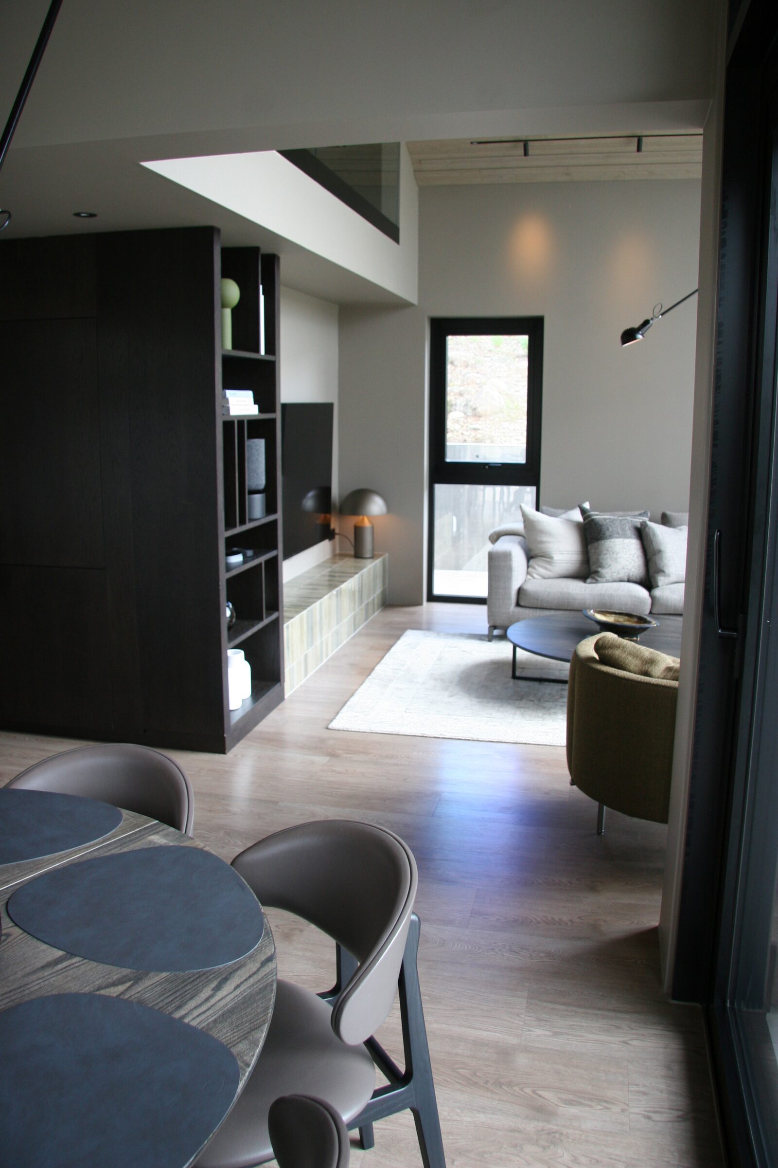 The hallway leading past the dining area towards the living area.